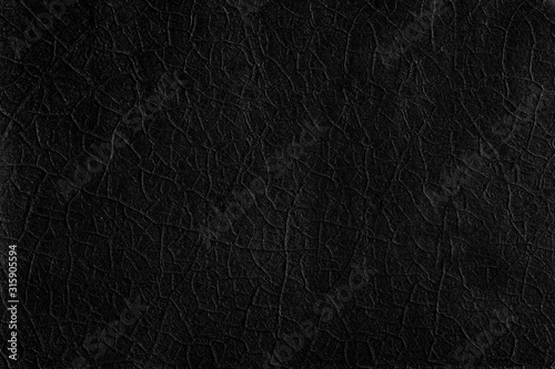 Black metal texture with old paint cracks, abstract black background Stock  Photo