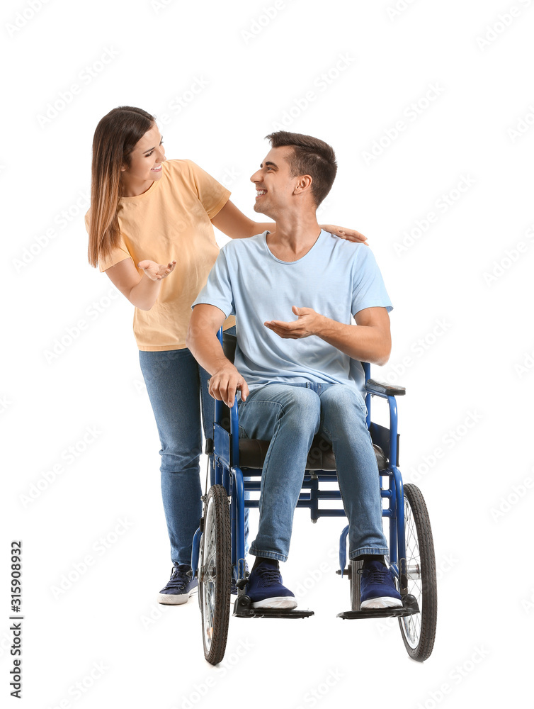 Handicapped young man in wheelchair and his wife on white background Handicapped young man in wheelchair and his wife on white background