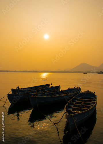 Fatehsagar lake evening still boats floating landscape, Udaipur