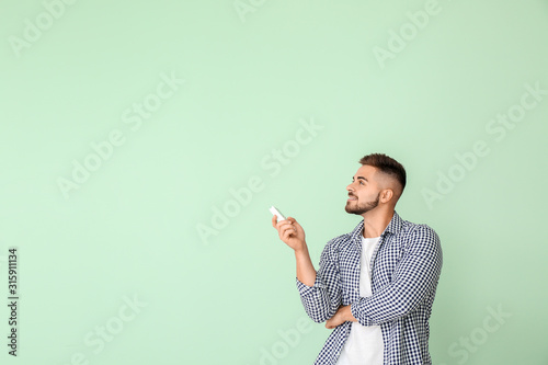 Young man with air conditio...