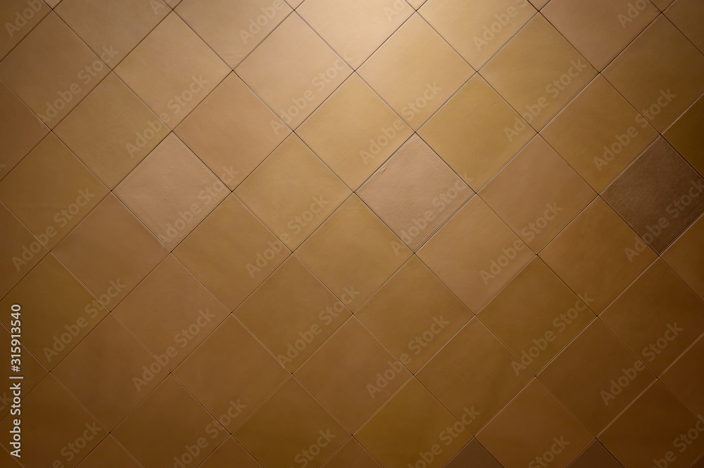 Wall decoration with brown leather tiles