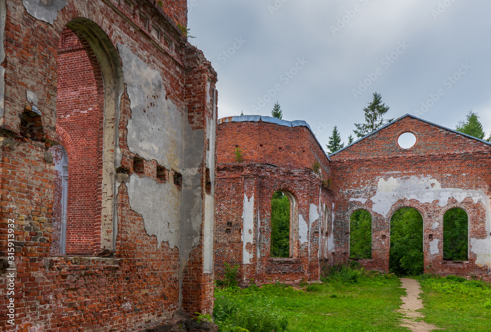 Ruined Lutheran church in Lahdenpohja, Karelia, Russia. Destroyed protestant temple in summer day. Architectural landmark in northern Russian town with Finnish heritage. Background for history theme