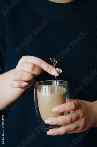 girl with a cup of hot coffee in her hands