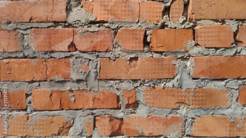 Brick background. Sloppy masonry of bricks of orange shades. For inscriptions and elements.