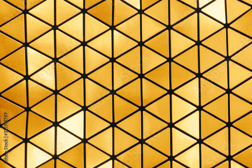 Gold and black abstract futuristic minimal metallic triangle ornament texture. Trendy art deco modern geometric background