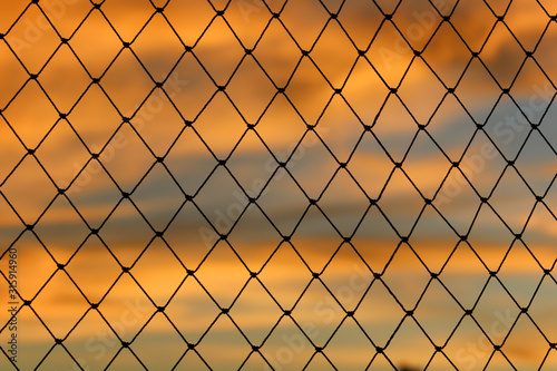 Chain fence sunset 
