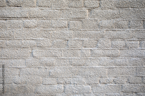 White brick wall. Decorative plaster, interior or exterior