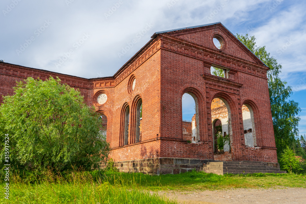 Ruined Lutheran church in Lahdenpohja, Karelia, Russia. Destroyed protestant temple in summer day. Architectural landmark in northern Russian town with Finnish heritage. Background for history theme