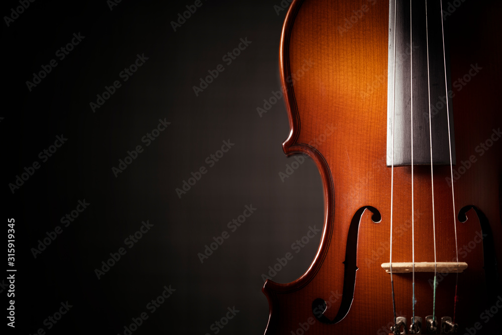 Beautiful antique violin on black background Beautiful antique violin on black background