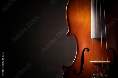 Fototapeta Beautiful antique violin on black background