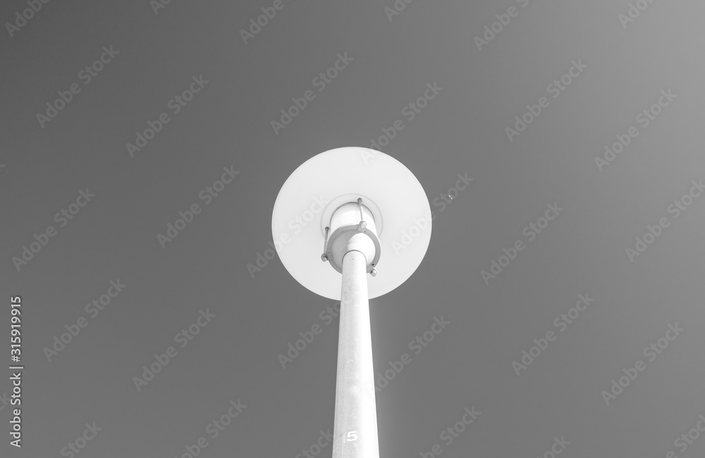 Isolated halogen street lamps. Outdoor lighting street pole. Minimal industrial design and detail. 