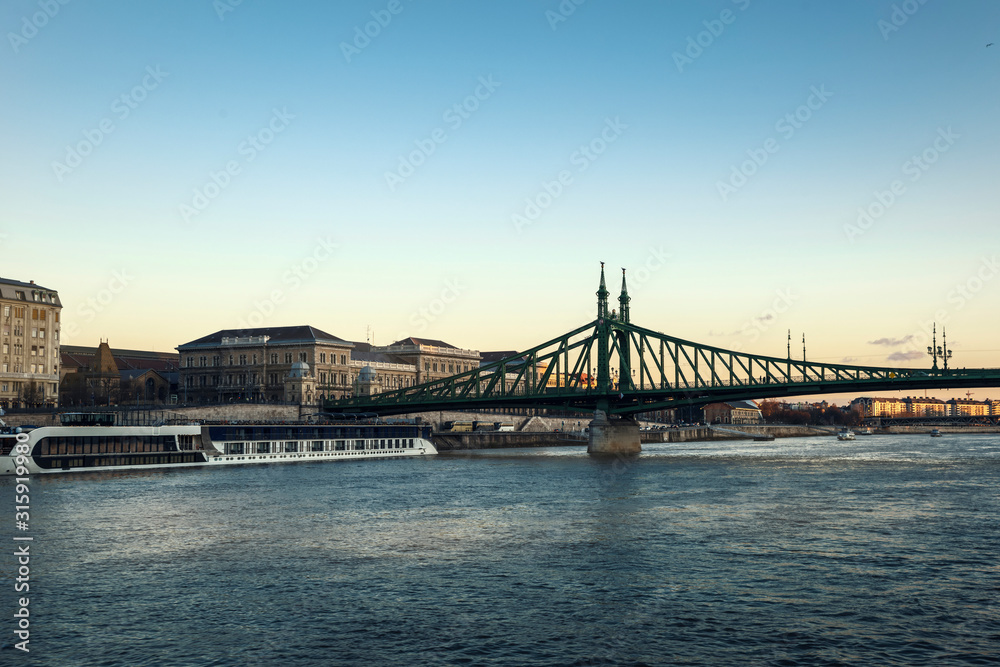 Fototapeta premium Fragment of Liberty Bridge and Pest Embankment in the city of Budapest, Hungary.