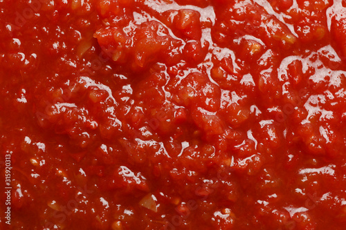 Foto Chili sauce textured background, top view, closeup