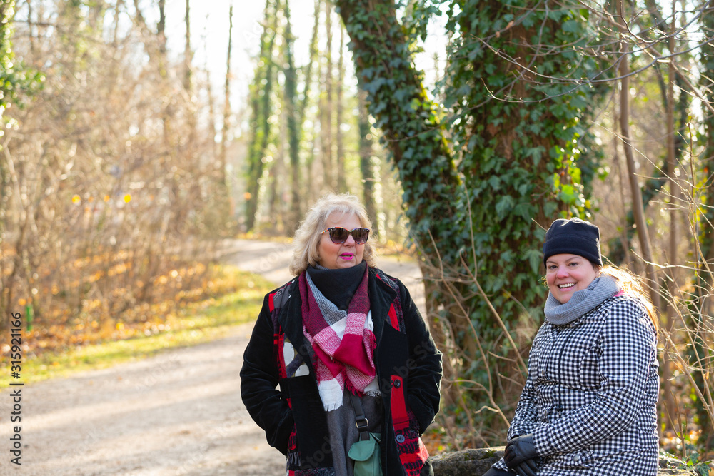 Couple of women out in the park for a portrait together. Couple of women out in the park for a portrait together.