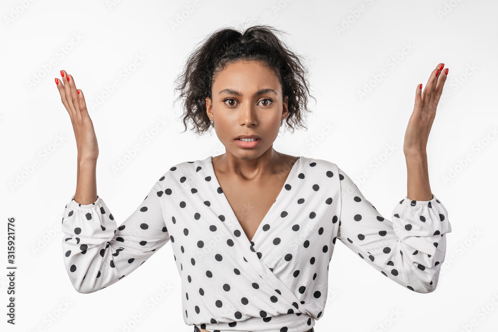 Angry african young woman isolated on white background looking at camera Angry african young woman isolated on white background looking at camera