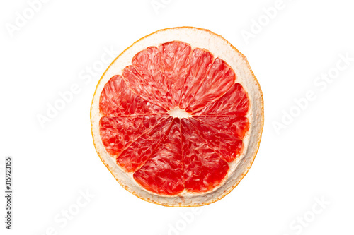 Slice of red dry grapefruit isolated on white background