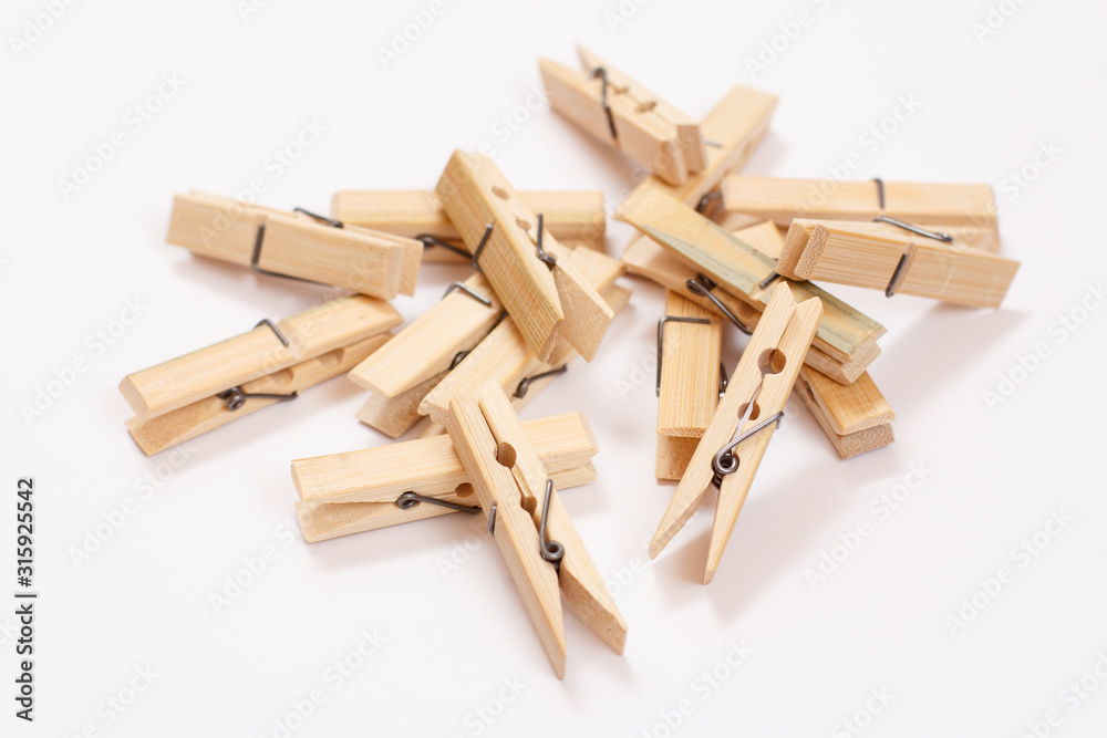 Set of wooden clothes pins on white background Set of wooden clothes pins on white background