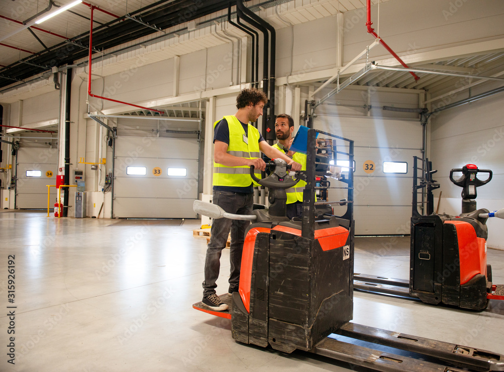 Training on a forklift, managers and workers Training on a forklift, managers and workers