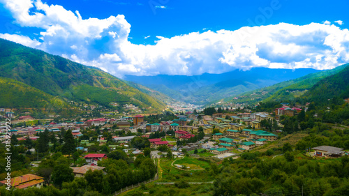 A large view of the capital of the Kingdom of Bhutan, called 'Thimphu' from a hill by day