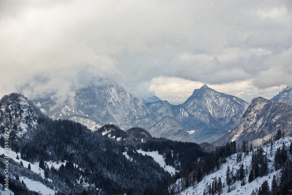 Beautiful fog in the high, rocky mountains in winter.