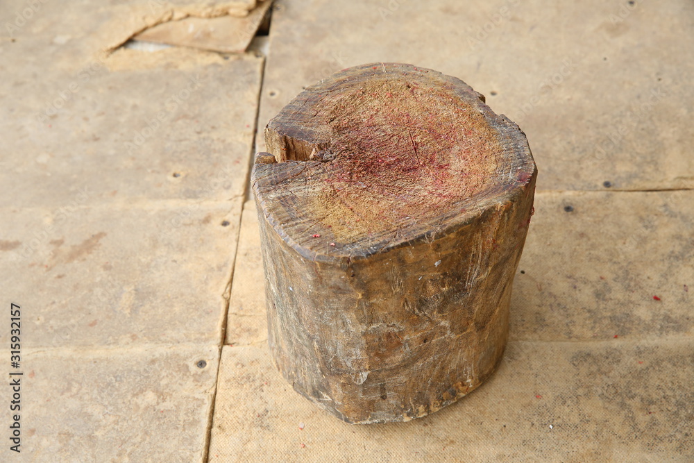 Chopping board block and Meat cleaver on wooden background . circle wooden chopping block in kitchen for meat slice . Chopping board block and Meat cleaver on wooden background . circle wooden chopping block in kitchen for meat slice .