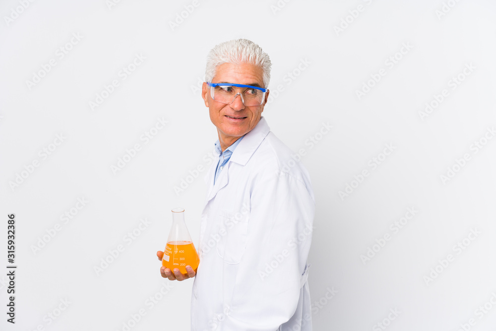 Mature chemical man isolated looks aside smiling, cheerful and pleasant. Mature chemical man isolated looks aside smiling, cheerful and pleasant.