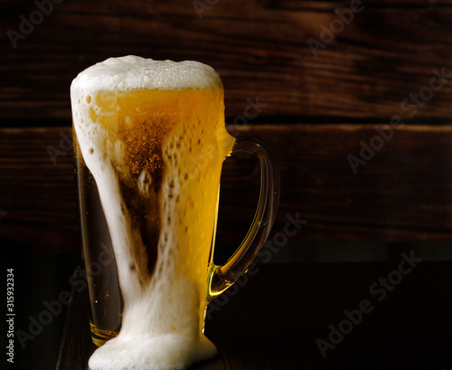 glass with beer and beer foam