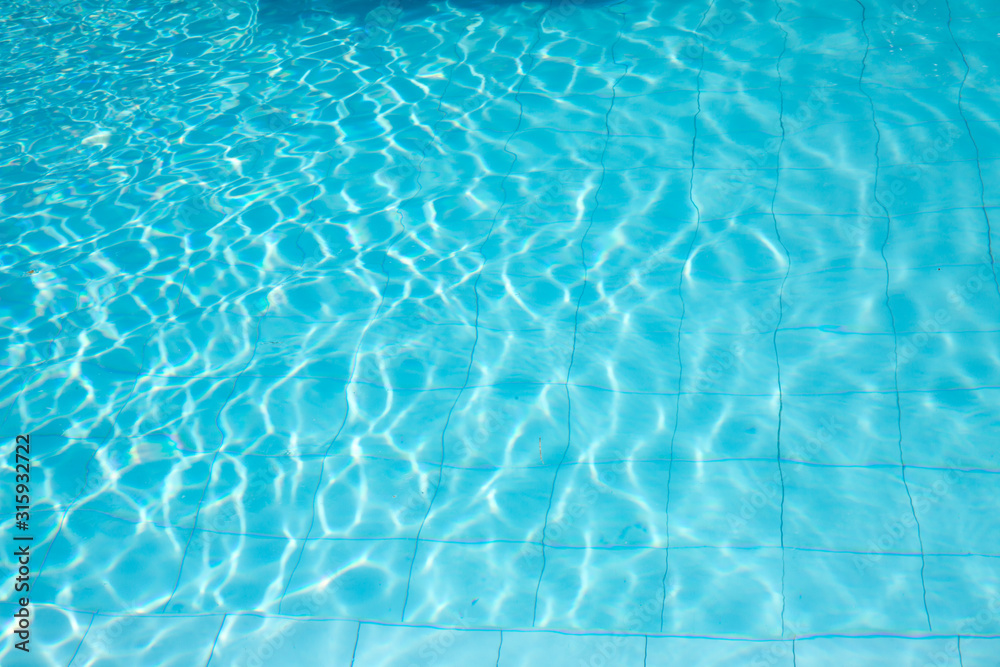 ripped water in swimming pool .surface of blue swimming pool,background of water in swimming pool. ripped water in swimming pool .surface of blue swimming pool,background of water in swimming pool.