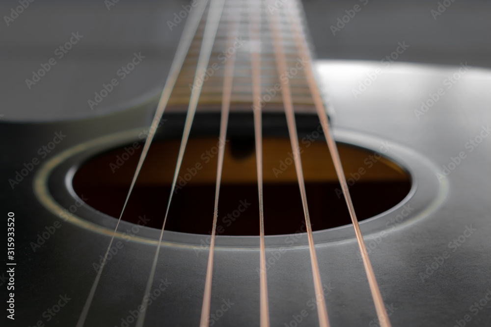 black acoustic guitar strings