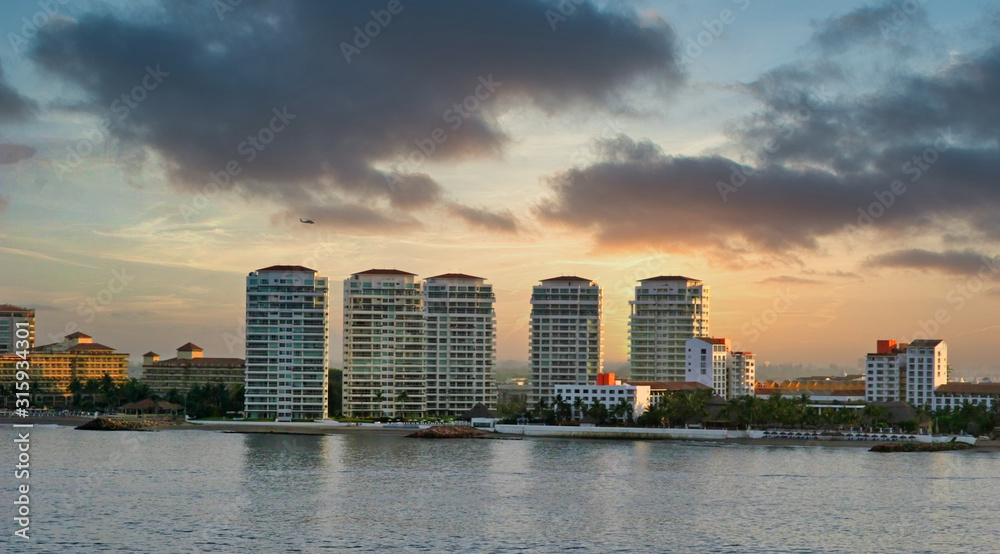 Fototapeta premium Rows of high rise coastal condos in dawn sun