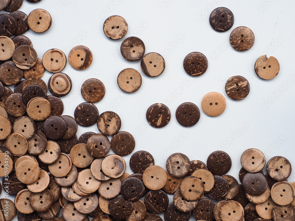 Wooden buttons pattern, Buttons made from Coconut shell, Can use as wallpaper or background. Wooden buttons pattern, Buttons made from Coconut shell, Can use as wallpaper or background.