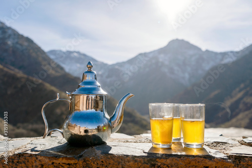 Famous Moroccan mint tea and silver kettle in High Atlas mountains