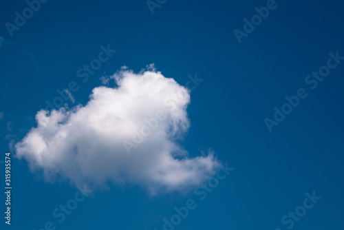 Blue Sky and Clouds. Daylight  mood. View  White clouds in the beautiful blue sky  Clouds in the blue sky. Oxygen  environment.