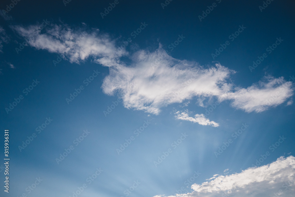 Blue Sky and Clouds. Daylight, mood. View, White clouds in the beautiful blue sky, Clouds in the blue sky. Oxygen, environment. Blue Sky and Clouds. Daylight, mood. View, White clouds in the beautiful blue sky, Clouds in the blue sky. Oxygen, environment.