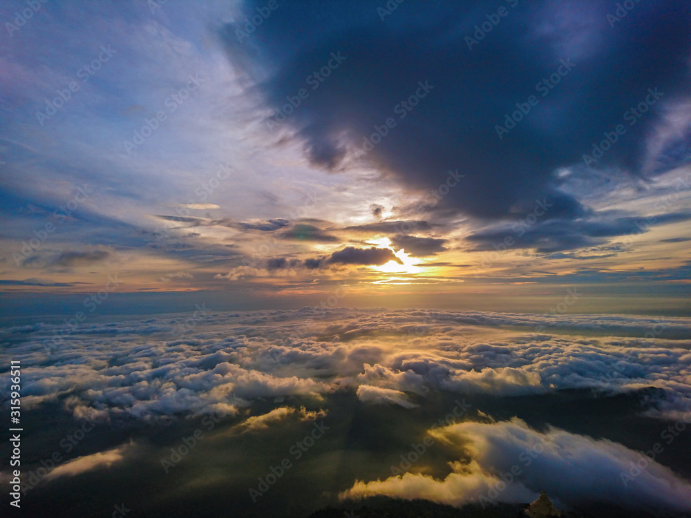 Beautiful Sunrise Sky with Sea of the mist of fog in the morning on Khao Luang mountain in Ramkhamhaeng National Park,Sukhothai province Thailand Beautiful Sunrise Sky with Sea of the mist of fog in the morning on Khao Luang mountain in Ramkhamhaeng National Park,Sukhothai province Thailand
