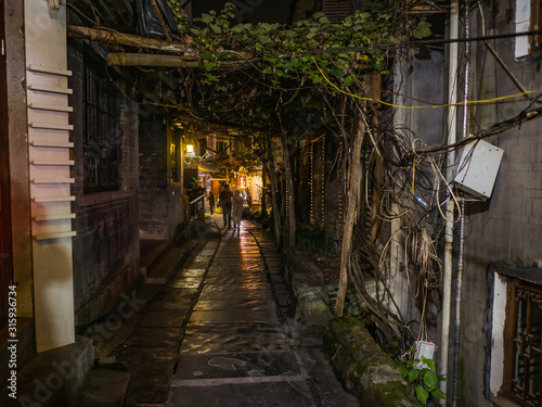 fenghuang,Hunan/China-16 October 2018:Tourist walking in alley building district of Fenghuang ancient town.phoenix ancient town or Fenghuang County is a county of Hunan Province, China