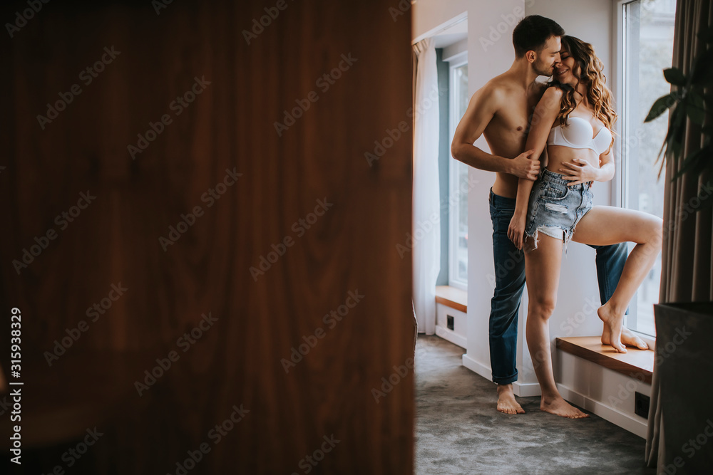 Young couple standing in the room