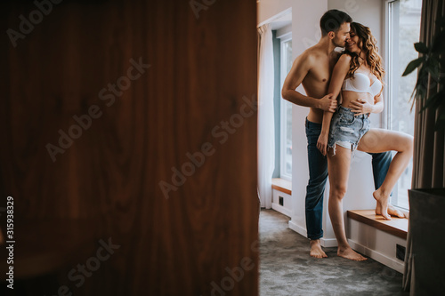Young couple standing in the room