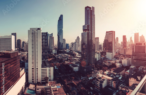 sunset rooftop view skyline bangkok twilight, office buildings, living, condominium in bangkok city skyline top view Downtown and business office bank financial in capital city of thailand asian 