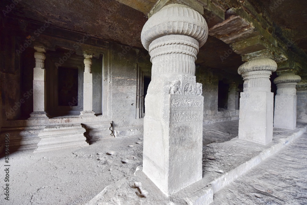 Rock-Carved Buddhist Pillars Inside the Ellora Caves