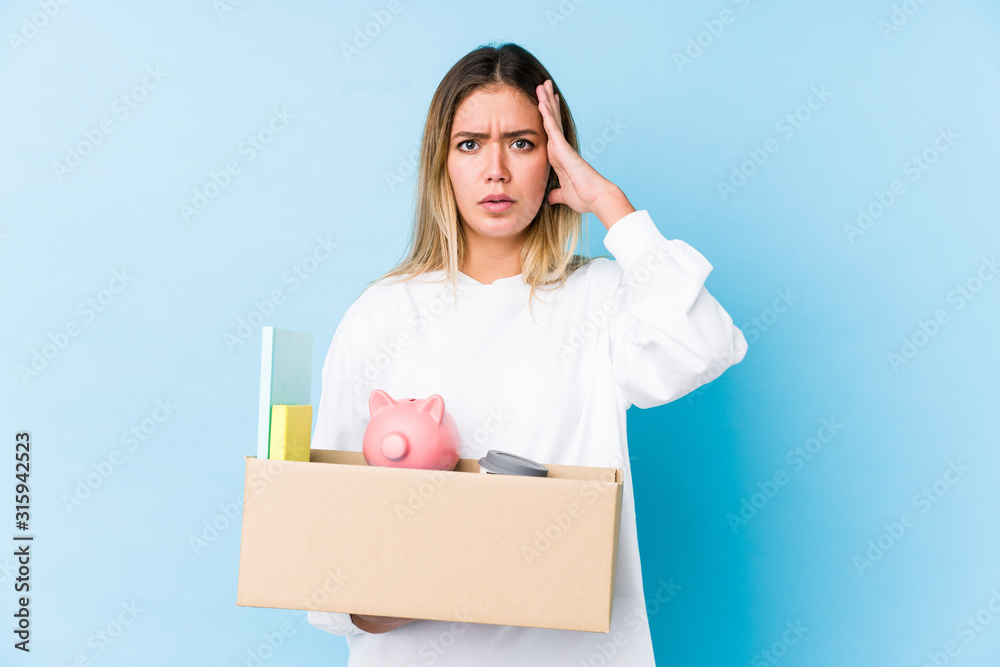 Young caucasian woman moving home isolated being shocked, she has remembered important meeting. Young caucasian woman moving home isolated being shocked, she has remembered important meeting.