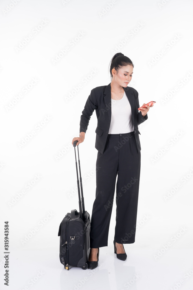 Businesswoman on a business trip, with luggage isolated on white background. Suitable for cut out, manipulation or composite works for travel or business concept. Businesswoman on a business trip, with luggage isolated on white background. Suitable for cut out, manipulation or composite works for travel or business concept.