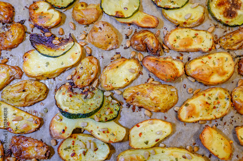 Stockholm, Sweden Grilled potatoes,  zucchini, with salt, oil, and sunflower seeds.
