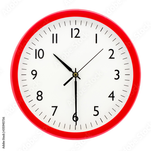 Clock with red round frame on white isolated background shows 10(22) hours 30 minutes_