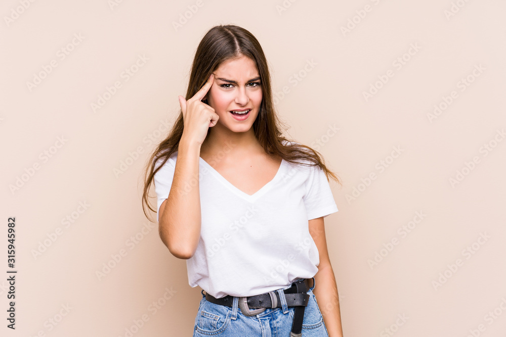 Young caucasian woman posing isolated showing a disappointment gesture with forefinger. Young caucasian woman posing isolated showing a disappointment gesture with forefinger.