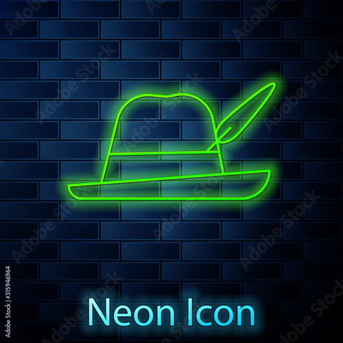 Glowing neon line Oktoberfest hat icon isolated on brick wall background. Hunter hat with feather. German hat. Vector Illustration