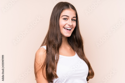Obraz na plátně Young cute caucasian woman against a beige background