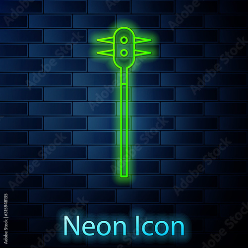 Glowing neon line Medieval chained mace ball icon isolated on brick wall background. Medieval weapon. Vector Illustration