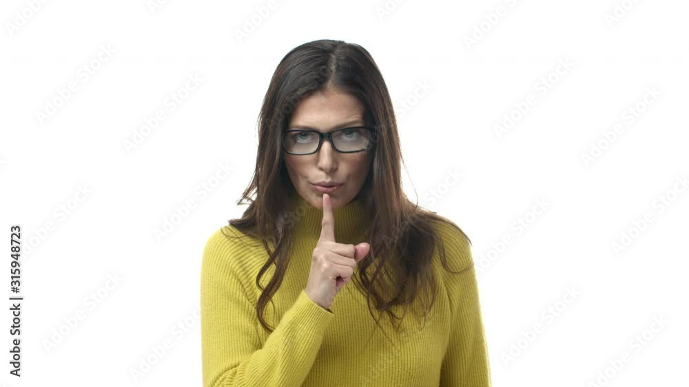 Slow-motion serious-looking strict and bossy female teacher in glasses, scolding for talking in class, shushing, tell be quiet, demand silence and good behaviour, standing white background Slow-motion serious-looking strict and bossy female teacher in glasses, scolding for talking in class, shushing, tell be quiet, demand silence and good behaviour, standing white background