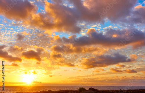 Sky with clouds above the Atlantic Ocean at sunset